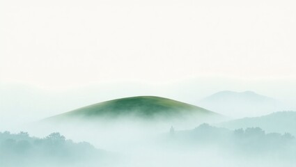 Fototapeta premium Green hill in misty morning landscape with soft white sky