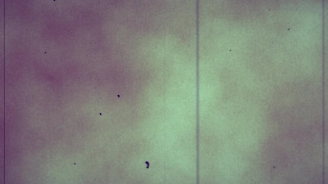 grungy old film with a vintage archive flickering noise and grain overlay special effect to be used as a texture layer to create a historical damaged worn film look to video 4K