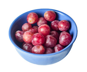 A blue bowl filled with fresh red grapes, isolated on white background. Appetizing still life celebrating healthy eating antioxidants and natural sweetness for wellness and diet concepts.
