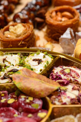 Sweet food Turkish delight on wooden background, assorted locum and candy for decorated backdrop