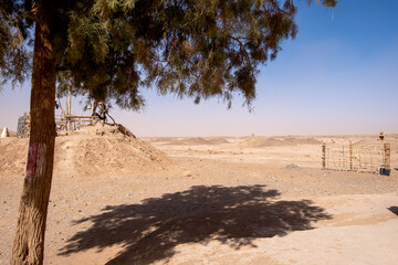 Kettaras, ventilation wells, view of desert marked by the  draining gallery,  on the road to Ourzazate. Morocco,  North Africa
