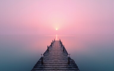 Obraz premium Empty Pier Extending into Pink Horizon. High quality