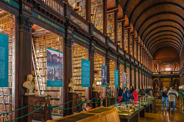 Visitors Explore the Historic Trinity College Library in Dublin, Ireland