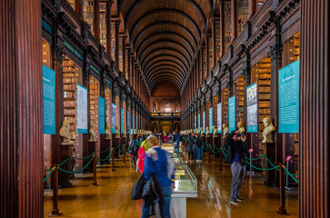 Fototapeta premium Tourists at the Iconic Trinity College Library in Dublin, Ireland