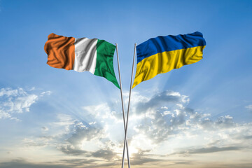 Waving National flag of Ukraine and flag of Ireland for international unity