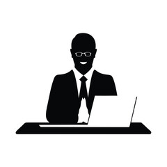 Businessman working on laptop silhouette
