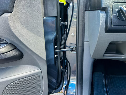 CloseUp of Vehicle Door Interior This is a Detailed View showcasing the Hinge Mechanism alongside the Seal, outlining the intricate aspects of the vehicles construction and craftsmanship