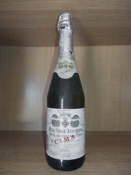Asturias, Spain, August 8, 2025. Antique bottle of Real Cidra Asturiana, Cima brand, in a collector's display case. Traditional Spanish product.