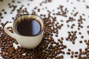 Coffee beans and a cup of black coffee. Coffee drink.