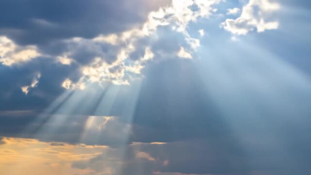Dramatic sky scene with dark clouds and piercing sunbeams, highlighting a serene, celestial atmosphere
