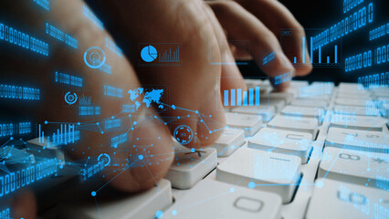 This dynamic image captures hands typing on a keyboard with overlay of digital data elements, illustrating the blend of technology and data analysis in modern workspaces. Xenic