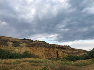cliff shore and dark sky