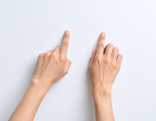 Two hands pointing upwards on a white background.