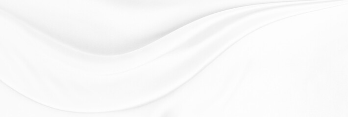 White gray satin texture that is white silver fabric silk panorama background with beautiful soft blur pattern natural.
