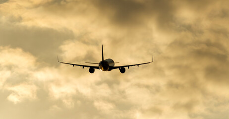 Passenger liner in the sky at sunset or dawn