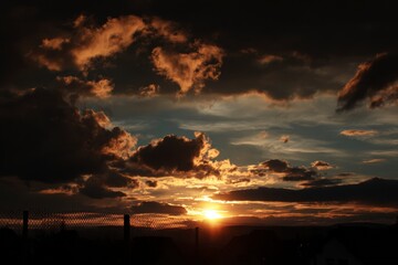 Fototapeta premium Sunset Over Landscape with Clouds
