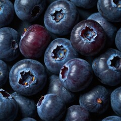 Obraz premium A close-up, high-detail macro shot of a blueberry cluster, illuminated by a single, dramatic spotlight in a dark studio. The focus is on the subtle blue and purple hues and the powdery bloom on the be