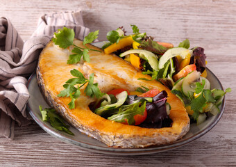 White fish steak with salad