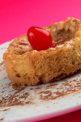 Delicious slice of apple cake with cinnamon dusting on a white plate