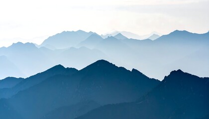 Obraz premium Serene Blue Mountain Range Silhouettes Under a Soft, Cloudy Sky
