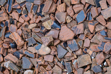 Pile of broken ceramic and tile fragments