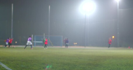 A vibrant evening on a soccer field with diverse kids enjoying the game. As the sun sets, excitement fills the air, showcasing their skills - Powered by Adobe