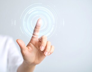 Fototapeta premium Close-up of a hand touching a digital interface with a glowing circle.