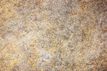 Weathered rusty metal surface closeup. Aged corroded steel with brown orange and grey tones. Industrial grunge background with rough texture and stains. Old oxidized material for vintage design.