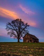 Fototapeta premium Rustic barn at sunset