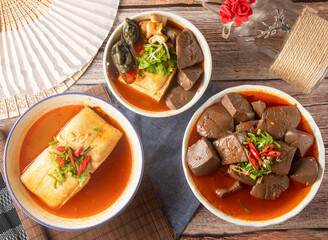 Chinese Spicy Stinky Tofu, Century Egg and Spicy Tofu Soup, Blood Curd, Duck Blood, and Pork Intestine top view of taiwan food