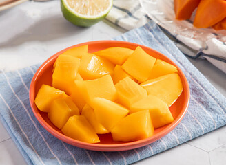 Freshly Diced Mango on a Plate close up side view of healthy fruit snack