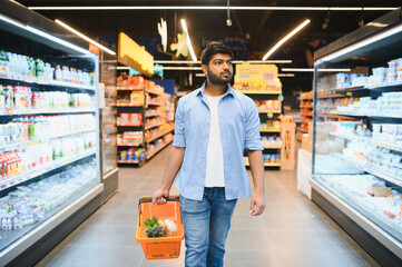 Indian man shopping for groceries in supermarket