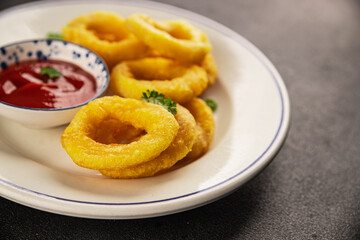 Colmar rings fried food fries fast food crispy appetizer fresh delicious gourmet food background on the table rustic food top view copy space