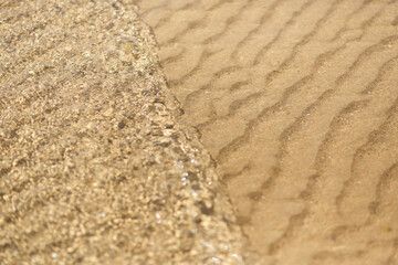 sand and sea water close up on the beach