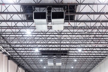 Air conditioning vents mounted on steel ceiling of cold storage warehouse