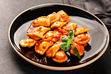 Ravioli beef tomato sauce second course fresh delicious gourmet food background on the table rustic food top view copy space