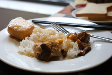 Tso's chicken with rice, onions and broccoli on the table. horizontal view from above . High quality photo