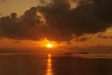 sunset over the sea with island