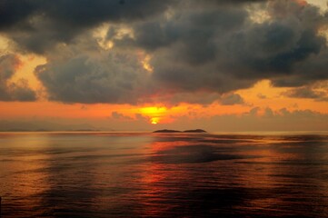 sunset over the sea with island