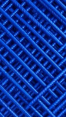 Naklejka premium Close-up of interwoven blue steel reinforcing bars