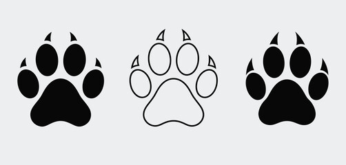 Fototapeta premium Three stylized paw prints in black and white outline and solid fill