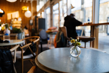 Cozy Cafe Interior with Elegant Floral Decor and Ambient Atmosphere for Relaxation and Work