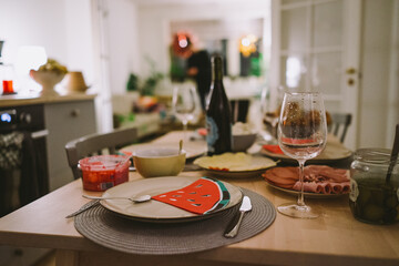 Cozy Home Dining Room with Elegant Table Setting and Wine Glasses Ready for Family Gathering