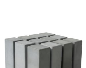 Grey concrete blocks isolated on white background showing solid industrial structure
