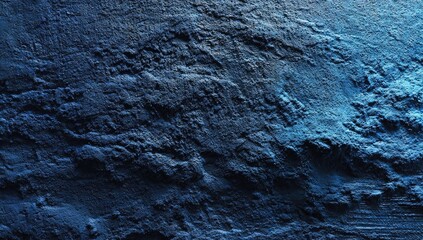 Obraz premium Textured deep blue wall, rough surface, dramatic lighting