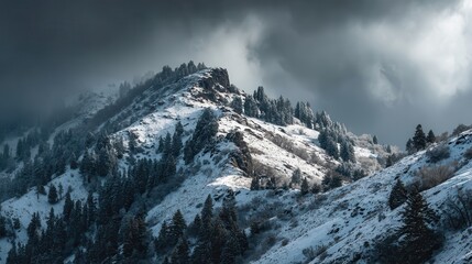 Obraz premium Winding road through snow-covered mountains at winter sunset showcasing nature's beauty and tranquility in remote areas
