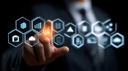 Hand interacting with a futuristic interface displaying various icons.