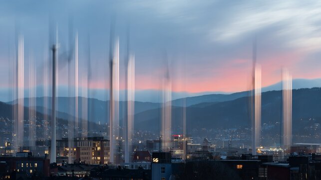 Long exposure photo of city lights at dusk with mountain backdrop - Powered by Adobe