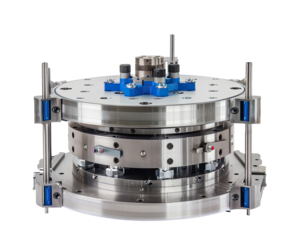 Precision metal circular machine.  Multiple layered, circular, stainless steel components,  mounted on support structures. 