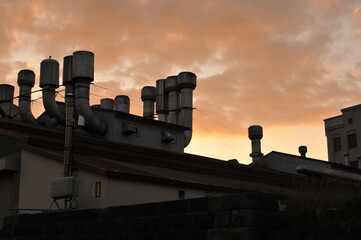 Factory chimney and sunset